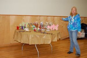 Our very own Vanna displays the prizes!